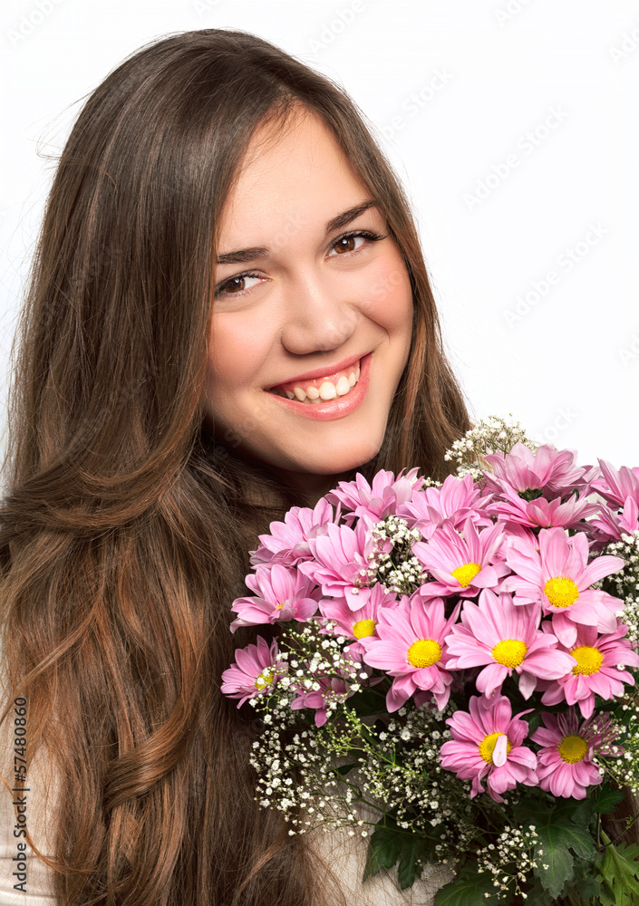 portrait of a beautiful girl with long hair and a pink flowers portrait of a beautiful girl with long hair and a pink flowers