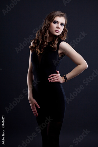 portrait of beautiful brunette over dark background