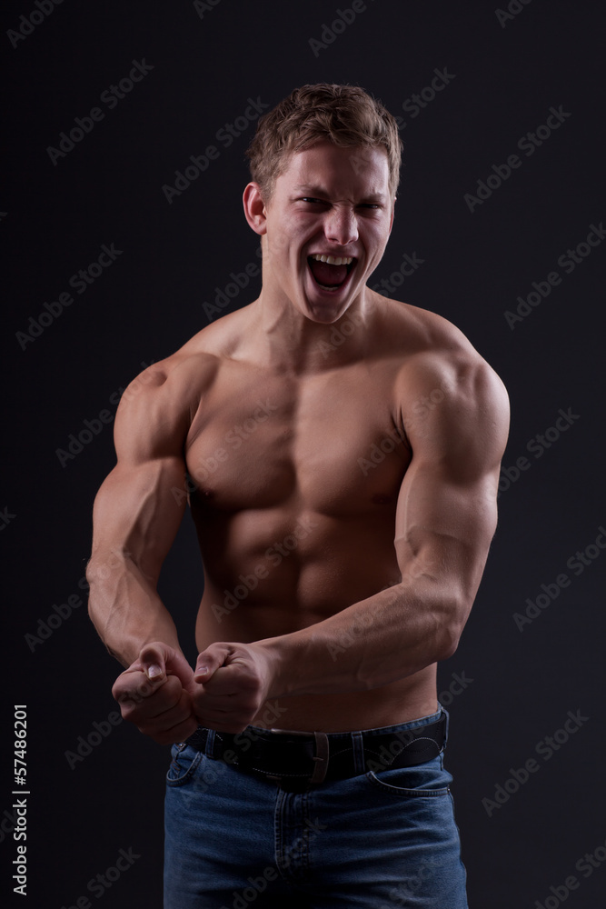 Muscle sexy naked young man posing in jeans Muscle sexy naked young man posing in jeans