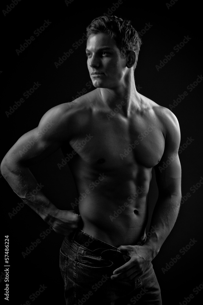 Muscle sexy naked young man posing in jeans Muscle sexy naked young man posing in jeans