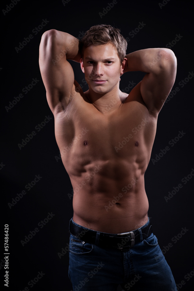 Muscle sexy naked young man posing in jeans Muscle sexy naked young man posing in jeans