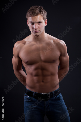 Muscle sexy naked young man posing in jeans © MaxFrost
