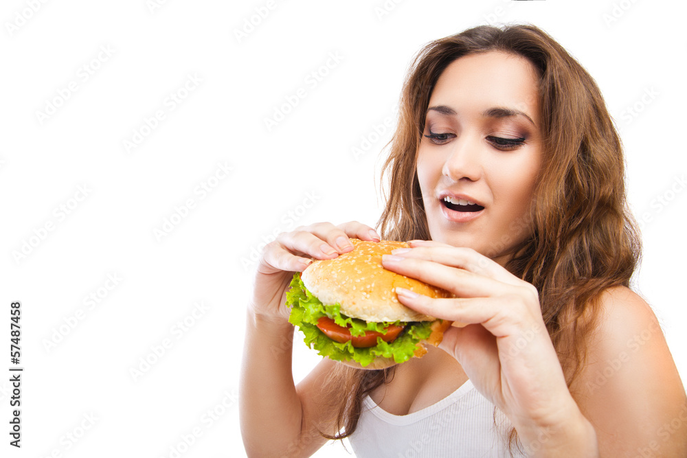 Happy Young Woman Eating big yummy Burger isolated Happy Young Woman Eating big yummy Burger isolated