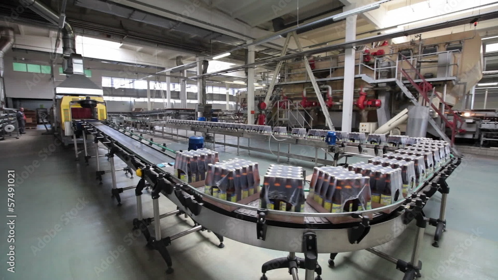 The brewery. Packaging of bottles moving on conveyor. The brewery. Packaging of bottles moving on conveyor.