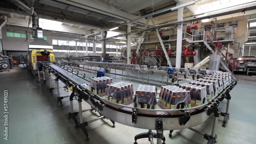 The brewery. Packaging of bottles moving on conveyor.