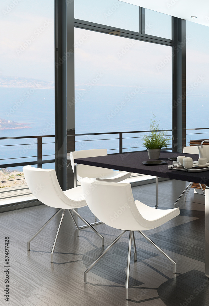 Modern dining table against floor to ceiling window with landsca