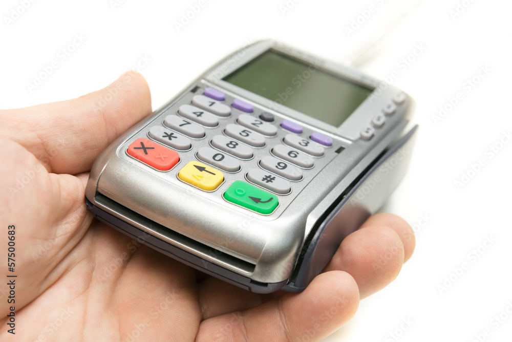 The modern bank terminal in a man's hand The modern bank terminal in a man's hand