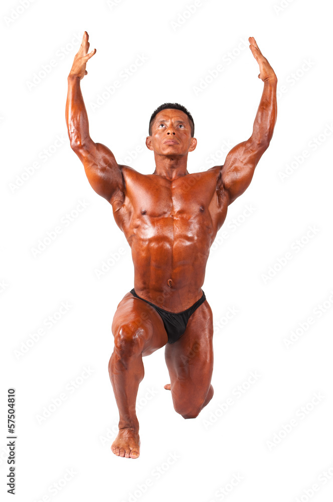Bodybuilder posing on a white background Bodybuilder posing on a white background