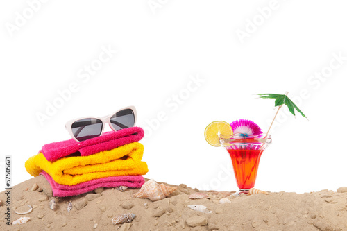 Beach sand with towels and cocktail