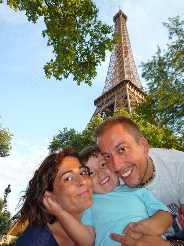 happy family in Paris holidays Eiffel tower