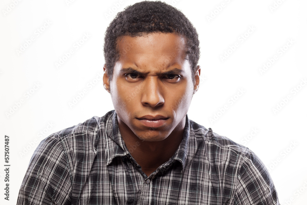 Fototapeta premium somber dark-skinned young man poses with angry expression