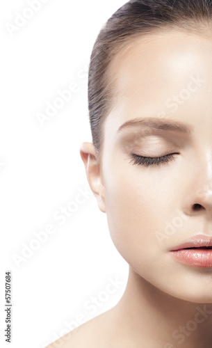 portrait of beautiful young woman with closed eyes isolated on w