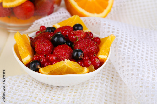 Useful fruit salad in glass cup and bowl
