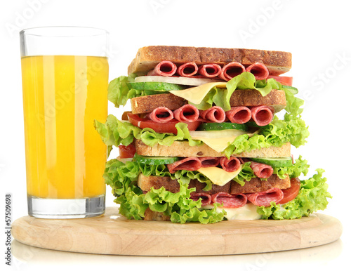 Huge sandwich on wooden board, isolated on white