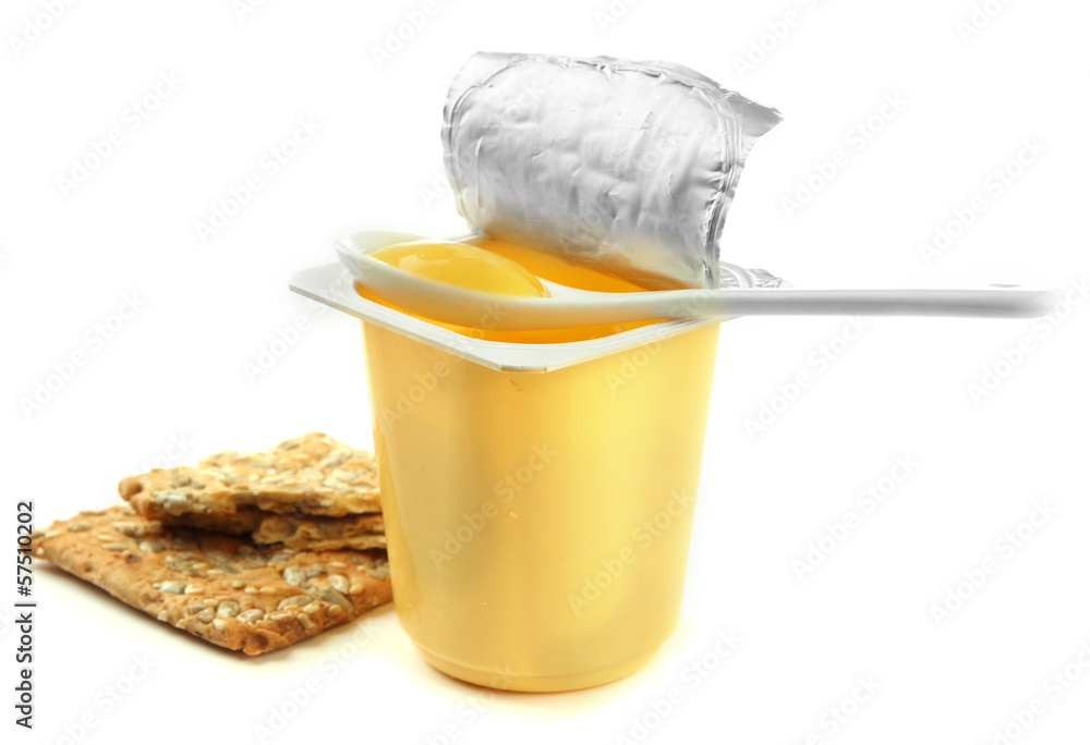 Tasty yogurt in open plastic cup, cookies and fruit, isolated Tasty yogurt in open plastic cup, cookies and fruit, isolated