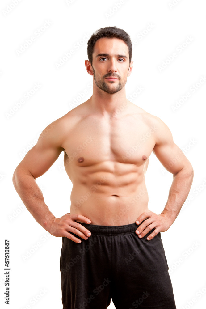 Fototapeta premium Fit Man Standing With Arms At His Waist