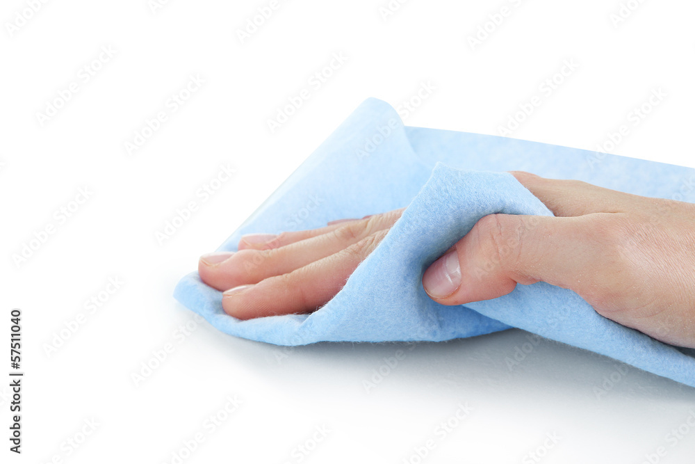 Hand wiping surface with blue rag isolated on white Hand wiping surface with blue rag isolated on white