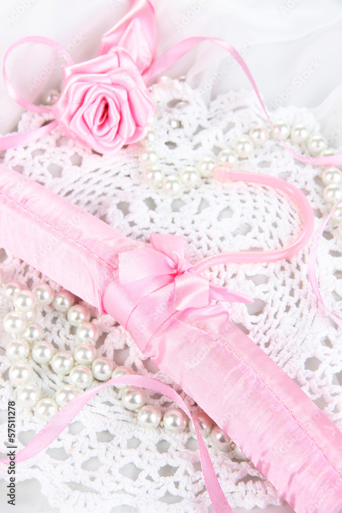 Beautiful hanger on fabric background Beautiful hanger on fabric background