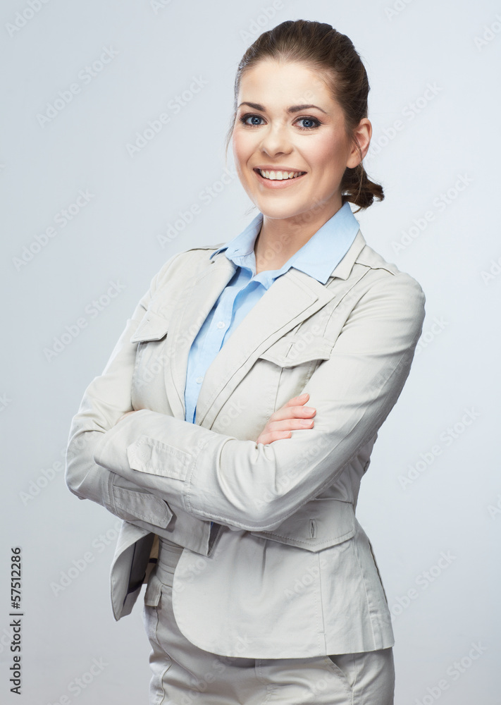 Business woman standing against isolated gray background. Business woman standing against isolated gray background.