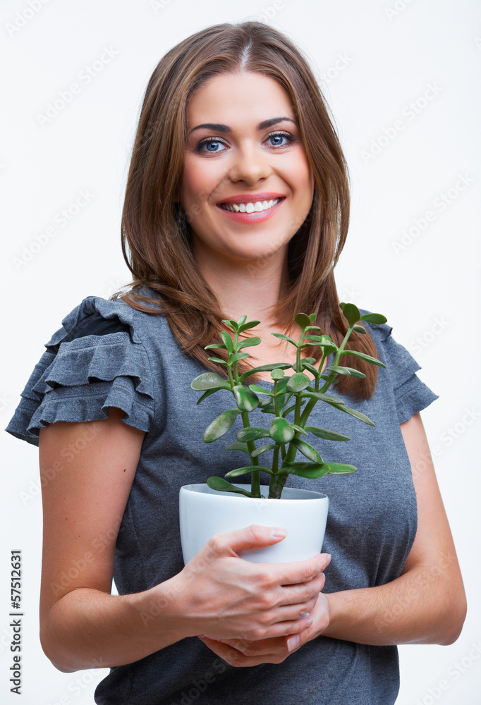 Smiling woman hold houseplant. Isolated on white background. Smiling woman hold houseplant. Isolated on white background.