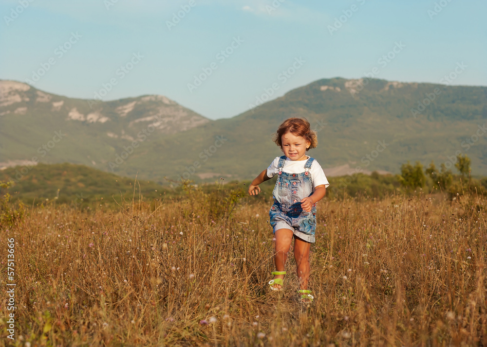 little girl walking on the field