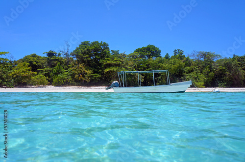 Tropical beach coastline with a boat