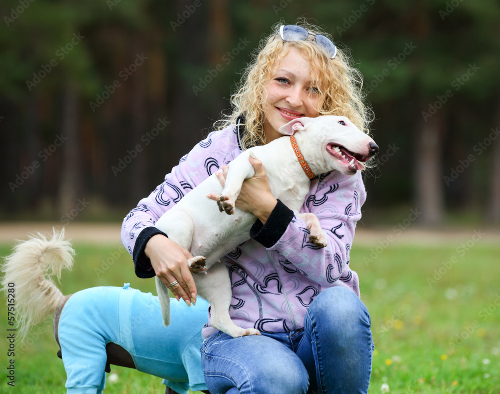 woman holding a small dog woman holding a small dog