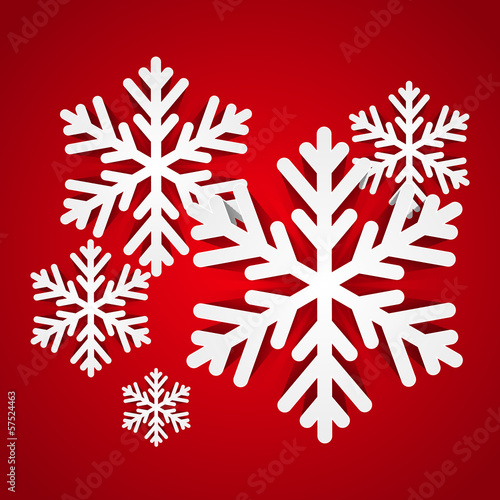 Paper snowflakes on red background