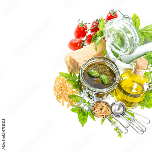 ingredients for fresh green pesto sauce on white background