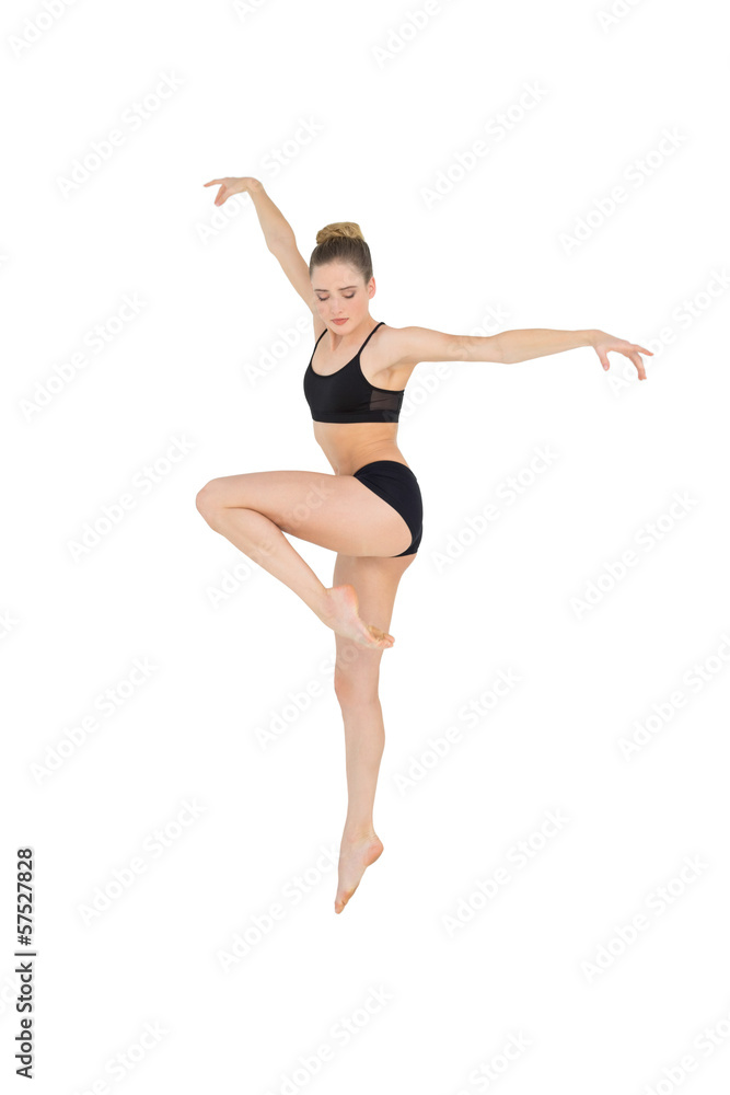 Calm slim model jumping in the air Calm slim model jumping in the air