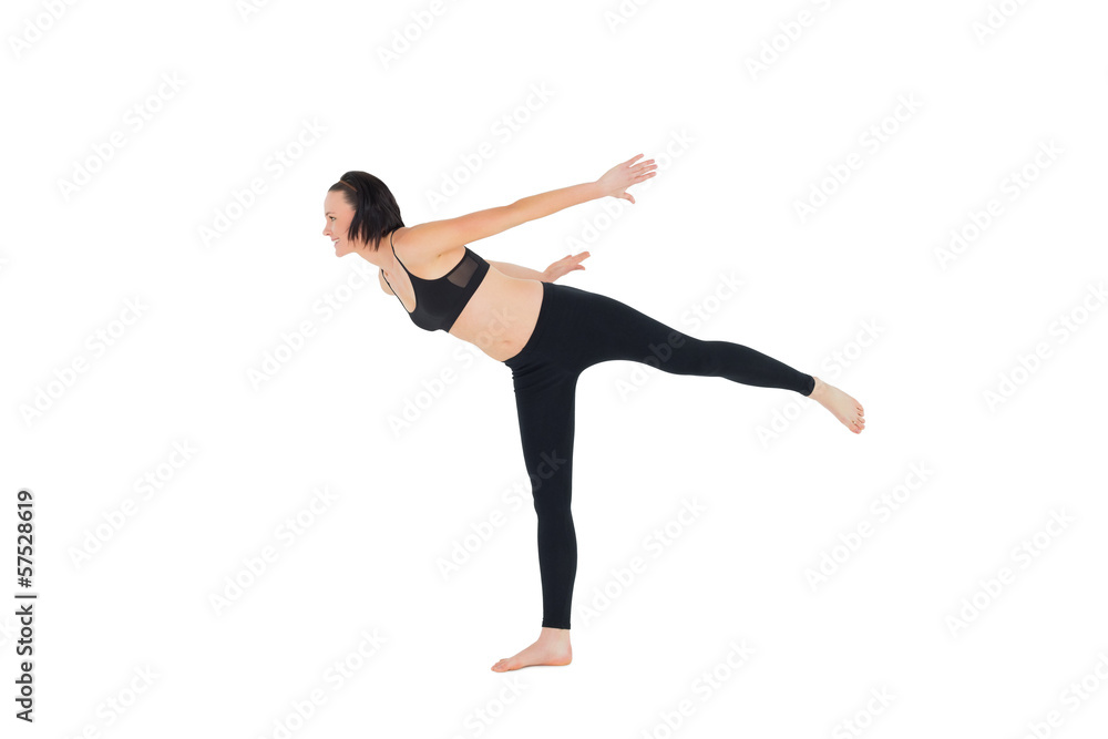 Side view of a sporty woman stretching