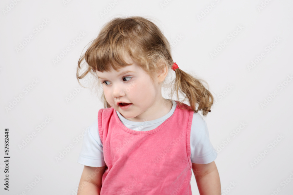 Little happy beautiful girl looks away and sings on white backgr Little happy beautiful girl looks away and sings on white backgr