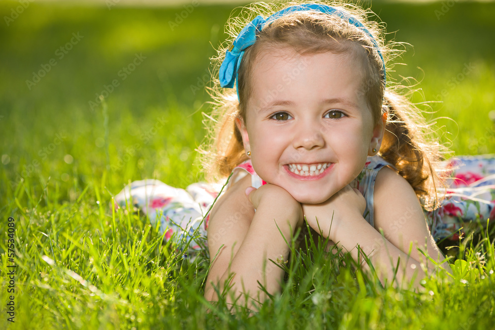 Laughing little girl on the grass Laughing little girl on the grass