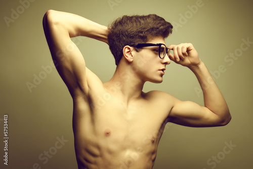 Beautiful (handsome) and muscular male model in trendy eyewear