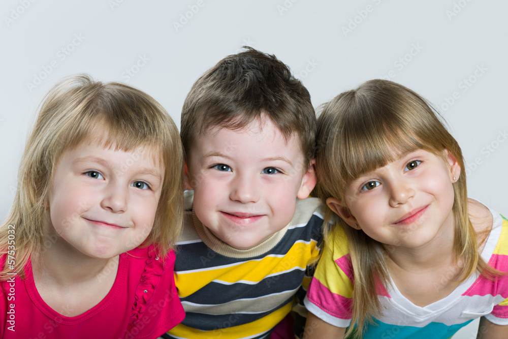 Closeup portrait of three cheerful children Closeup portrait of three cheerful children