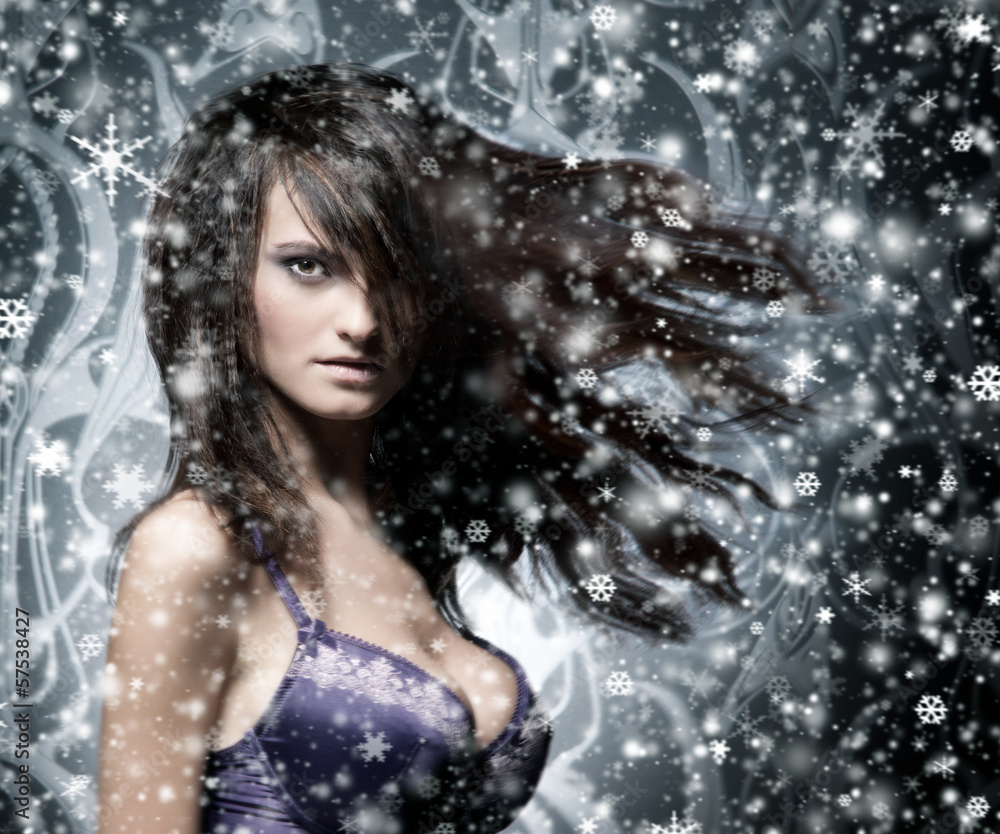Portrait of an attractive girl in lingerie on a snowy background Portrait of an attractive girl in lingerie on a snowy background