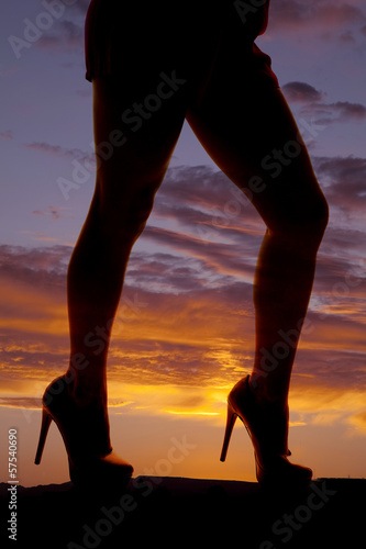 silhouette woman heels legs side walk