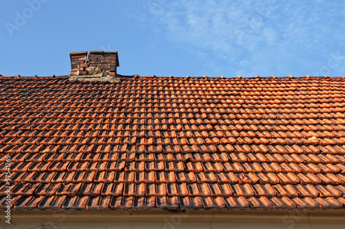 old red tile roof with chimney © chrupka