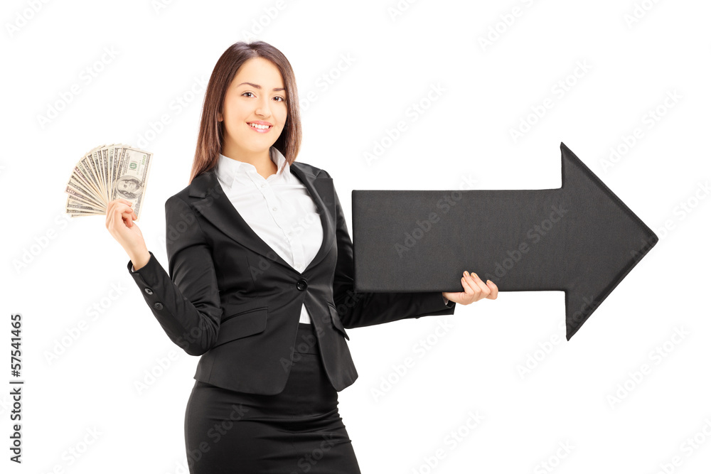 Young businesswoman holding an arrow pointing to the right Young businesswoman holding an arrow pointing to the right