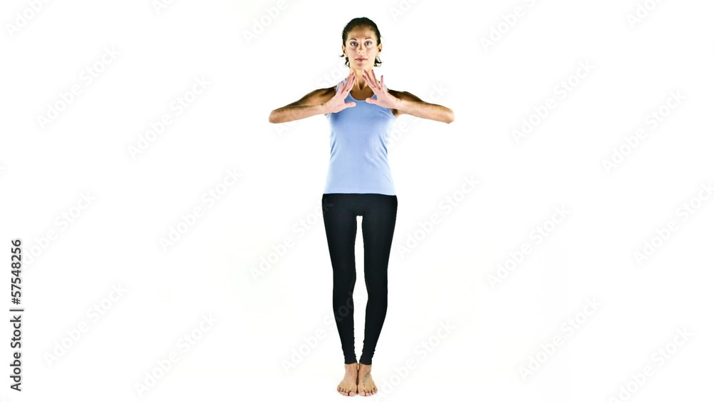 young woman practices yoga moves in studio young woman practices yoga moves in studio