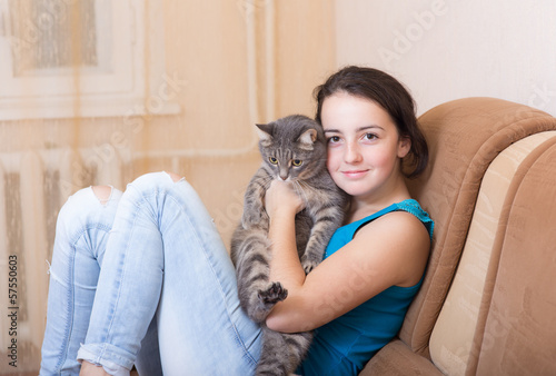 on the couch with a pet © Maslov Dmitry
