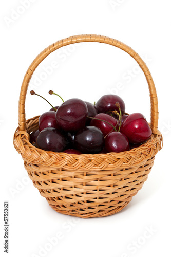 sweet cherry in a basket over white
