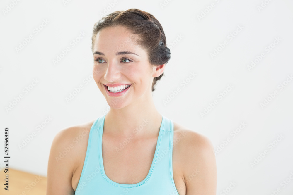 Smiling young woman in blue sports bra Smiling young woman in blue sports bra