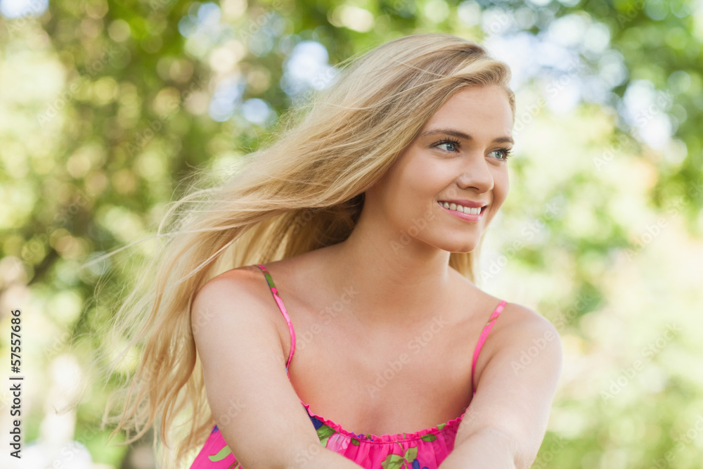 Beautiful casual woman sitting on a lawn Beautiful casual woman sitting on a lawn