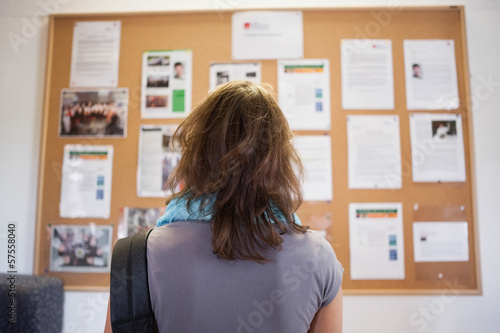 Student studying notice board photo
