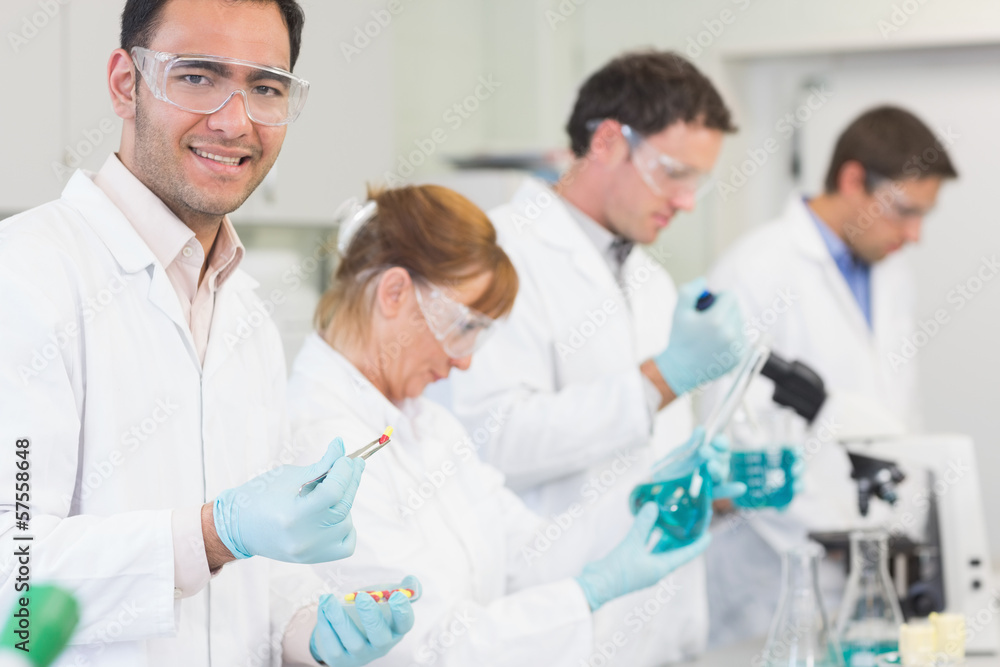Group of scientists working at the laboratory Group of scientists working at the laboratory