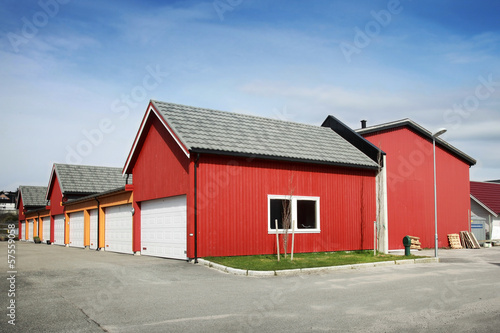 Traditional rural red and yellow wooden Norwegian garages