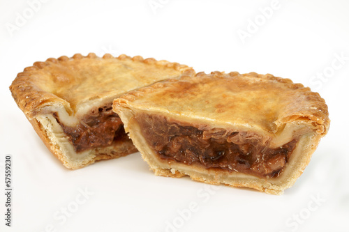 Bild auf Leinwand Savoury meat pie with a beef filling cut in to two halves