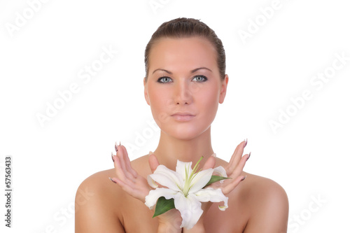 Beauty face of the young beautiful woman with flower