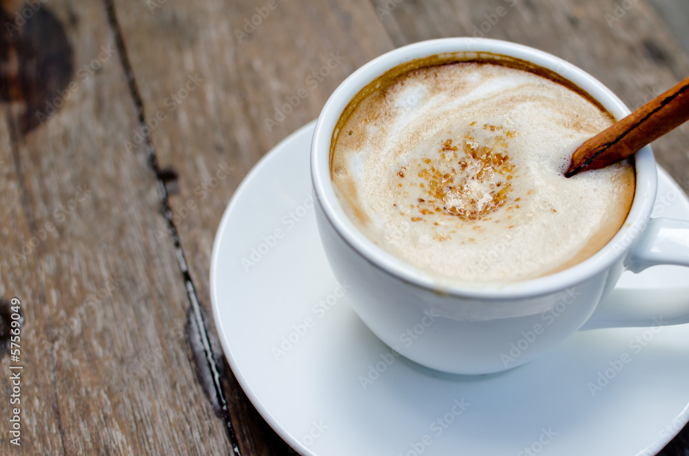 A cup of hot latte with cinnamon A cup of hot latte with cinnamon